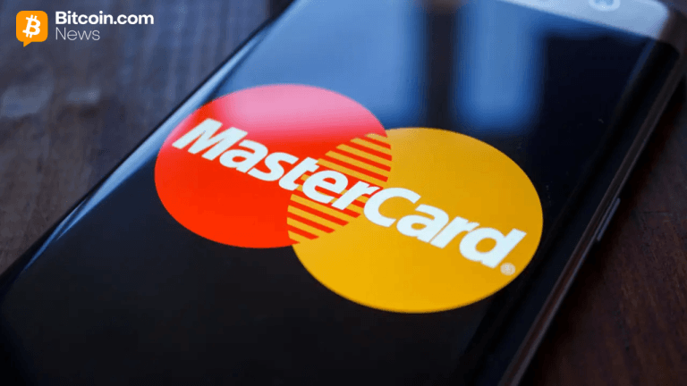 Mastercard payments network logo on a smartphone.