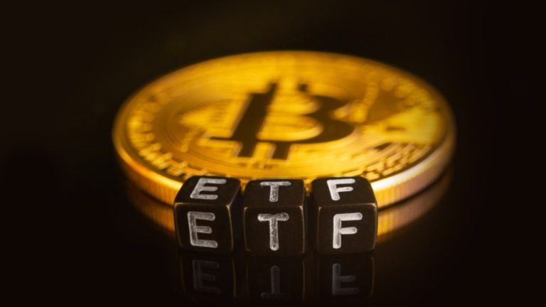 ETF on dice with bitcoin in background