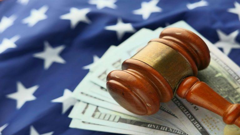 US flag, dollar bills, and a gavel
