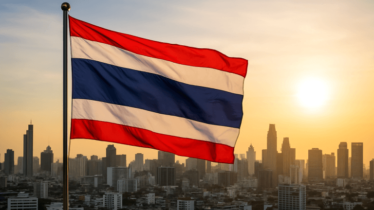 Flag of thailand against a setting sun